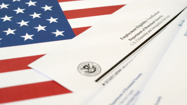 the American flag and paper documents